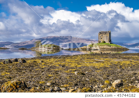 View of the Castle Stalker in autumn on the low tide near Port Appin, Argyll - Scotland View of the Castle Stalker in autumn on the low tide near Port Appin, Argyll - Scotland 45744182