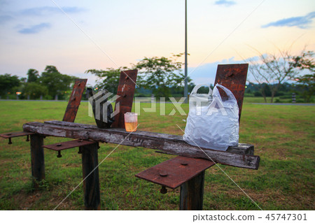 ice in bag plastic on wooden chair old in ice in bag plastic on wooden chair old in 45747301