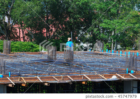 construction laborer team working on building  45747979