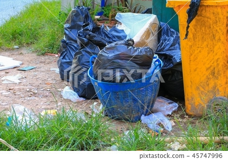Pile black garbage bag and bucket roadside Pile black garbage bag and bucket roadside 45747996