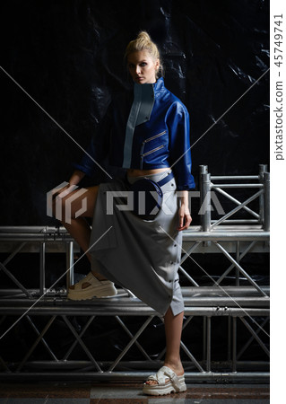 Girl in wide oversized leather jacket and skirt  45749741