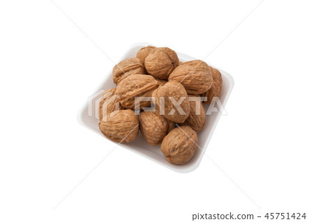 Pile of walnuts on a white background Pile of walnuts on a white background 45751424