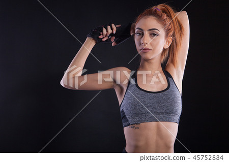 Portrait of beautiful fitness girl during studio photoshoot 45752884
