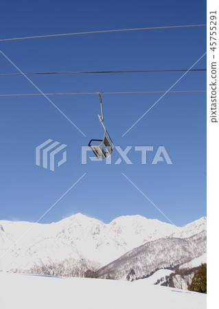 A ski lift in Hakuba-mura, Nagano Prefecture, operating against the sunny northern Alps Hakuba Sanzan 45755291