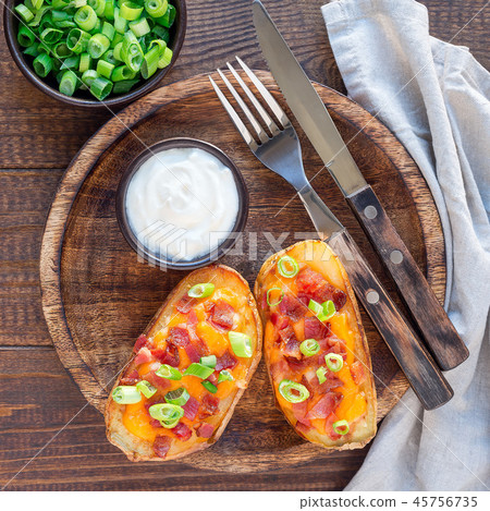 Baked potato skins with cheddar cheese and bacon Baked potato skins with cheddar cheese and bacon 45756735