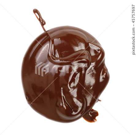 Hot melted chocolate pouring isolated on white background, top view 45757697