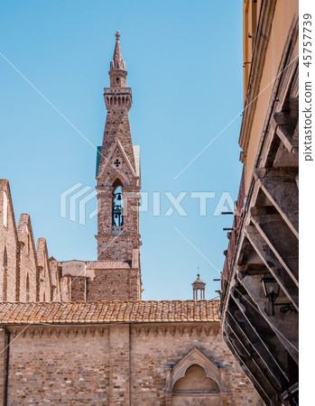 High narrow tower with bell in the Florence town High narrow tower with bell in the Florence town 45757739