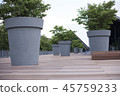 Gray giant flower pot with green plant 45759233