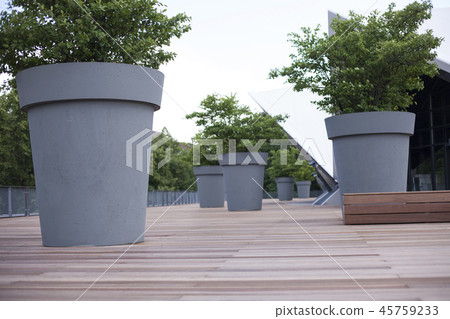 Gray giant flower pot with green plant Gray giant flower pot with green plant 45759233