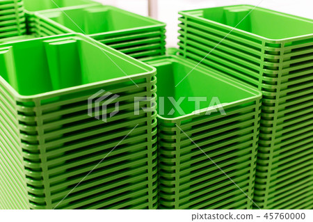 Green plastic home containers tower at store 45760000