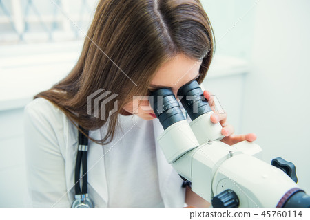 Close up gynecologist working with colposcope 45760114