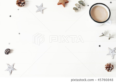 Christmas composition. Eucalyptus branches, wooden stars, pine cones, cinnamon sticks and glittering 45760848