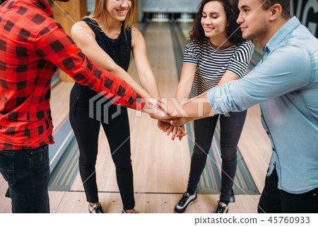 Bowling team joined hands before the competition 45760933