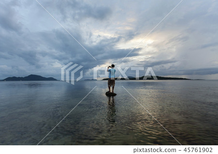 Alone man tourist standing on the stone Alone man tourist standing on the stone 45761902