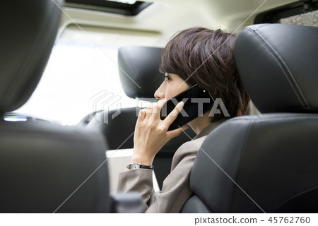 Woman working in a car Woman working in a car 45762760