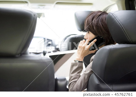 Woman working in a car Woman working in a car 45762761