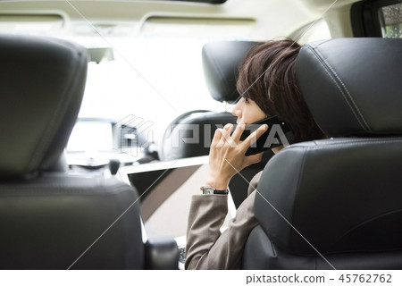 Woman working in a car Woman working in a car 45762762