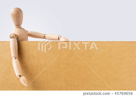 wooden mannequin hold empty board 45769056