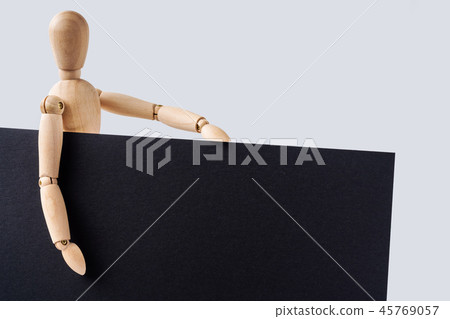 wooden mannequin hold empty board 45769057