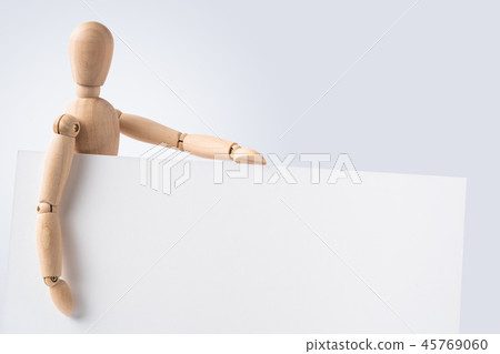 wooden mannequin hold empty board 45769060