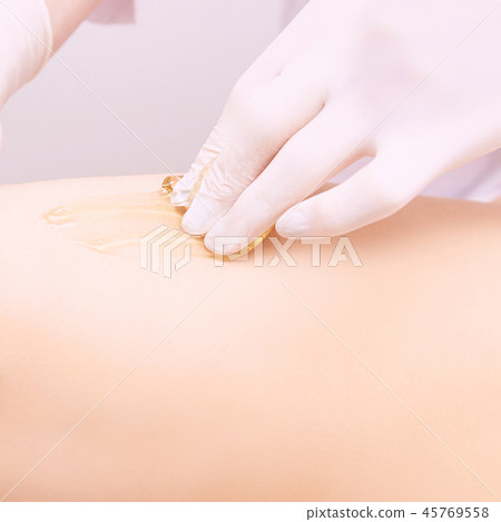 Depilation spa procedure. Woman hair remove waxing 45769558