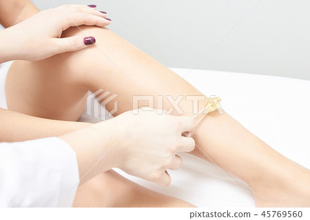 Depilation spa procedure. Woman hair remove waxing 45769560