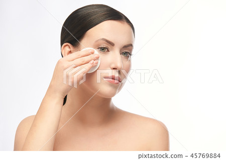 Young girl remove cosmetic from face. skin care  45769884