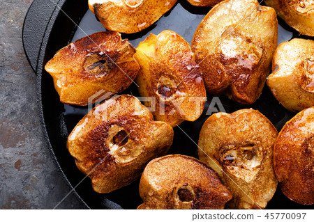 Apple quince baked with honey and cinnamon Apple quince baked with honey and cinnamon 45770097