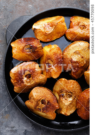 Apple quince baked with honey and cinnamon Apple quince baked with honey and cinnamon 45770098