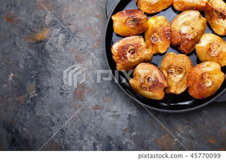 Apple quince baked with honey and cinnamon Apple quince baked with honey and cinnamon 45770099