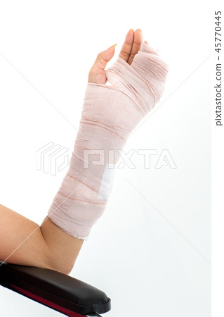 Broken arm isolated in white. 45770445