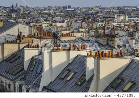 The roofs of Paris and its chimneys under a clouds sky The roofs of Paris and its chimneys under a clouds sky 45771893