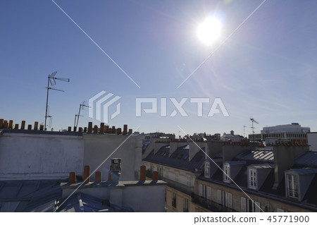 The roofs of Paris and its chimneys under a clouds sky 45771900