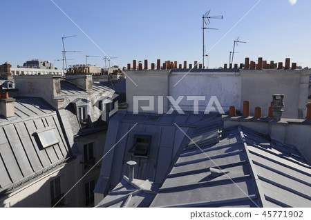 The roofs of Paris and its chimneys under a clouds sky 45771902