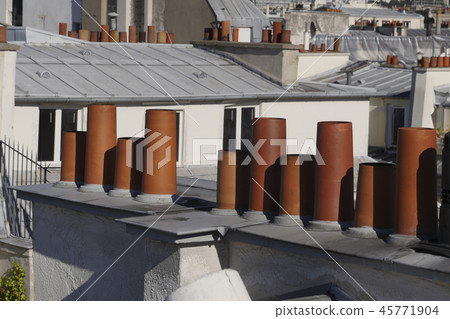The roofs of Paris and its chimneys under a clouds sky 45771904