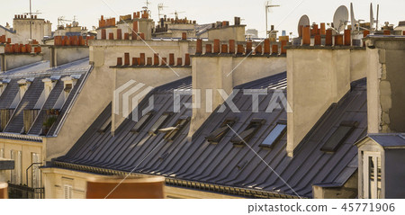 The roofs of Paris and its chimneys under a clouds sky The roofs of Paris and its chimneys under a clouds sky 45771906