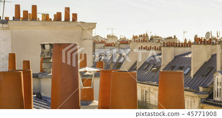 The roofs of Paris and its chimneys under a clouds sky The roofs of Paris and its chimneys under a clouds sky 45771908