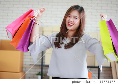 Woman happy with her shopping bags. Woman happy with her shopping bags. 45773377