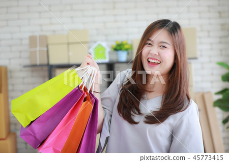Woman happy with her shopping bags. 45773415