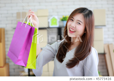 Woman happy with her shopping bags. Woman happy with her shopping bags. 45773416