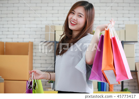 Woman happy with her shopping bags. Woman happy with her shopping bags. 45773417