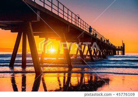 Iconic Glenelg Beach jetty at sunset 45776109