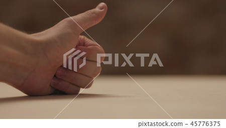 closeup man hand touches plywood to check surface closeup man hand touches plywood to check surface 45776375