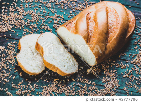 cut Fresh wheat bread with grains around cut Fresh wheat bread with grains around 45777796