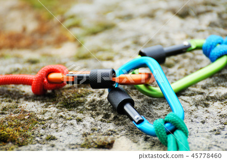Carabiner  on rocky background. 45778460