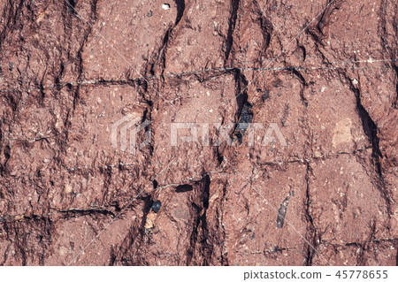 Red fractured stone surface background Red fractured stone surface background 45778655