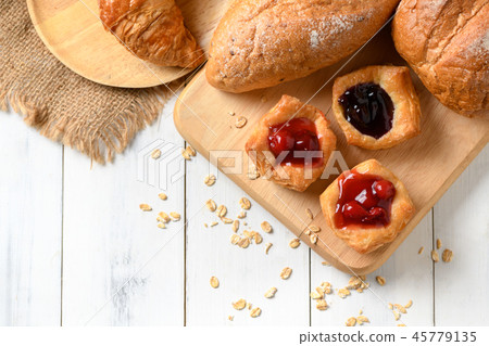 Danish bread with fruit,blueberry and cherry sauce Danish bread with fruit,blueberry and cherry sauce 45779135
