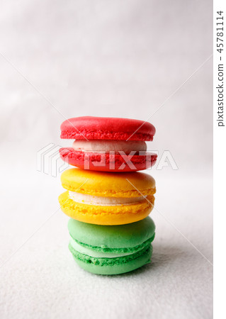 Different kind of macaroons in stack on white Different kind of macaroons in stack on white 45781114