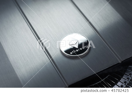 Ethereum Silver coin lies on the metallic surface Ethereum Silver coin lies on the metallic surface 45782425