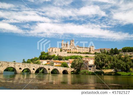 Old bridge and Saint Nazaire cathedral on the Orb river in Beziers Old bridge and Saint Nazaire cathedral on the Orb river in Beziers 45782527